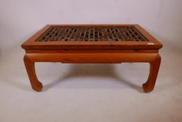 A Chinese pine coffee table with lattice carved top, 18" x 40" x 24