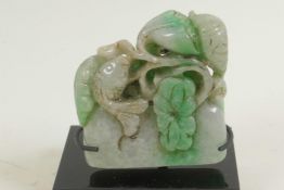 A Chinese jade seal blank, carved with fish and water plants, 2½" high