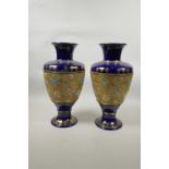 A pair of Doulton Slater's Patent vases, 13" high, stamps to base, A/F