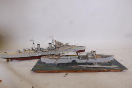 A scratch built motorised card and wood model of a British Naval battleship, 42" long, and a diorama