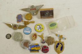 A small collection of enamel badges etc