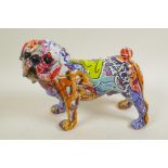 A composition figure of a pug dog, with multicoloured graffiti style decoration, 7½" high
