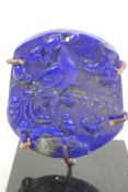 A Chinese carved lapis amulet decorated with a phoenix, 2½" high