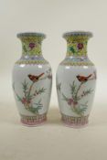 A pair of Chinese Republic porcelain vases with famille rose decoration of birds amongst flowers,