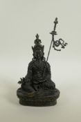 A Sino-Tibetan bronze of Buddha seated on a lotus throne, 10" high