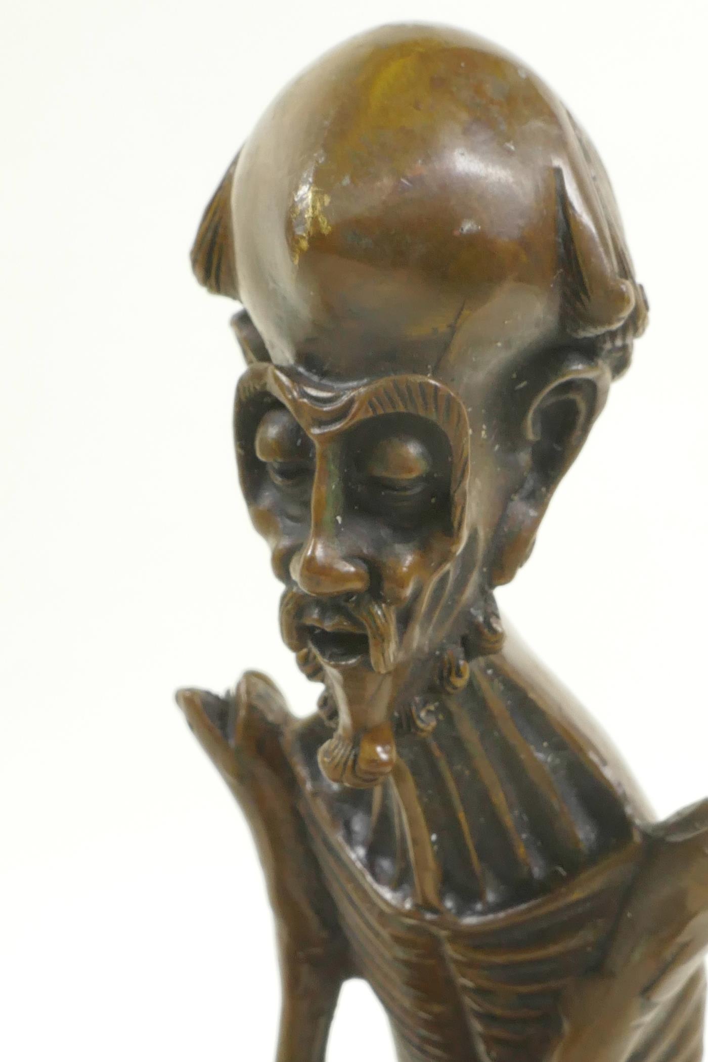 A bronze figure of a skeletal man, 8½" high - Image 6 of 7