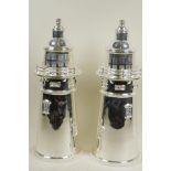 A pair of silver plated cocktail shakers in the form of lighthouses, 14" high