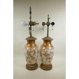 A pair of Japanese Meiji Kutani vases with brass mounts converted into lamps, decorated with Asiatic