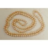 A single strand pearl necklace, 48" long