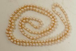 A single strand pearl necklace, 48" long