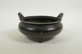 A Chinese bronze censer on tripod supports with phoenix eye handles, impressed seal mark to base, 7"