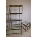 A contemporary brushed steel open display unit with glass shelves and matching occasional table, 31"