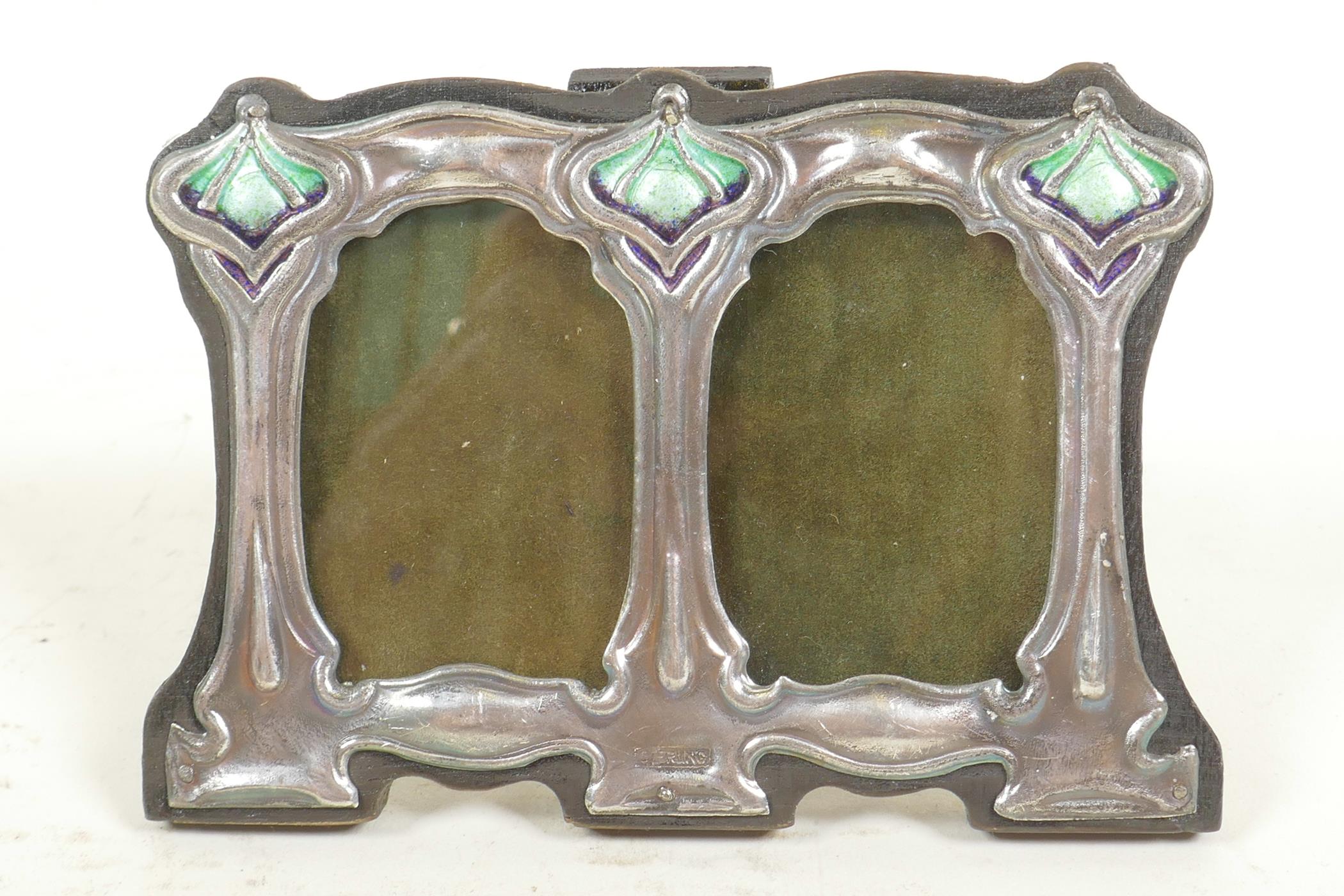 A sterling silver Art Nouveau style double photo frame and apertures, 1½" x 2½"