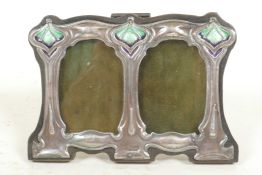 A sterling silver Art Nouveau style double photo frame and apertures, 1½" x 2½"