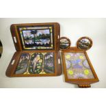 Three Brazilian butterfly membrane trays in inlaid hardwood frames, two featuring views of Rio de