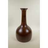 A brown glazed ribbed ceramic vase, 16½" high