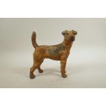 A cold painted metal dog doorstop, 8½" high