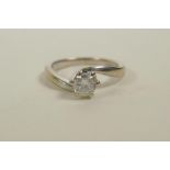 A 9ct white gold and diamond set engagement ring, approximate size 'O'