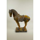 A Chinese terracotta Tang horse with a Sancai glaze, 15½" x 14" long
