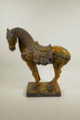 A Chinese terracotta Tang horse with a Sancai glaze, 15½" x 14" long