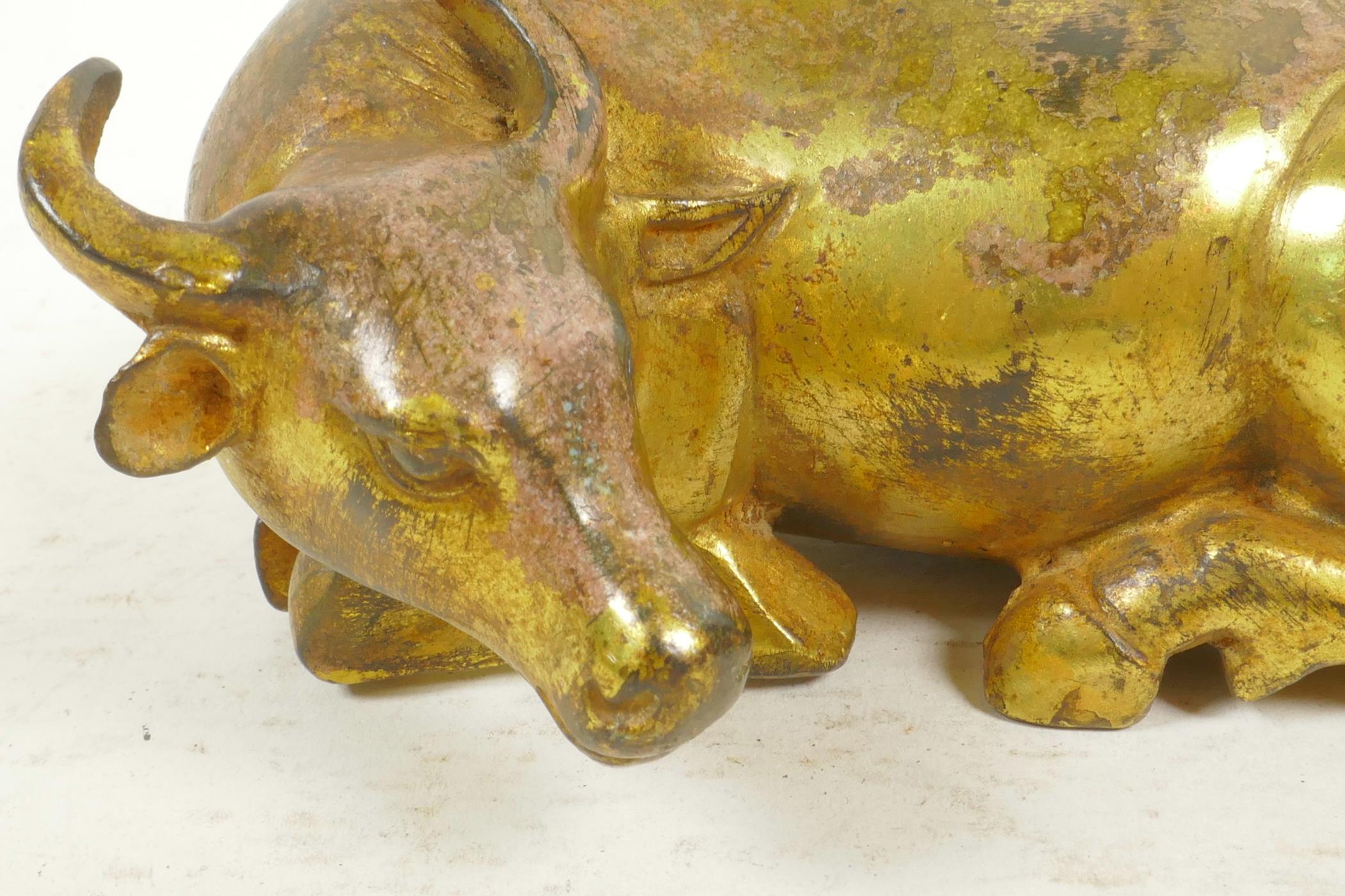 A Chinese gilt bronze figurine of a buffalo and his boy handler, 7" long - Image 2 of 4