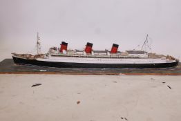 A diorama with scratch built scale model of a passenger liner, 56" x 12"