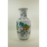 A Chinese famille verte porcelain rouleau vase decorated with travellers in a landscape, six