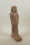 An Egyptian reconstituted stone figure of a pharaoh, 11½" high