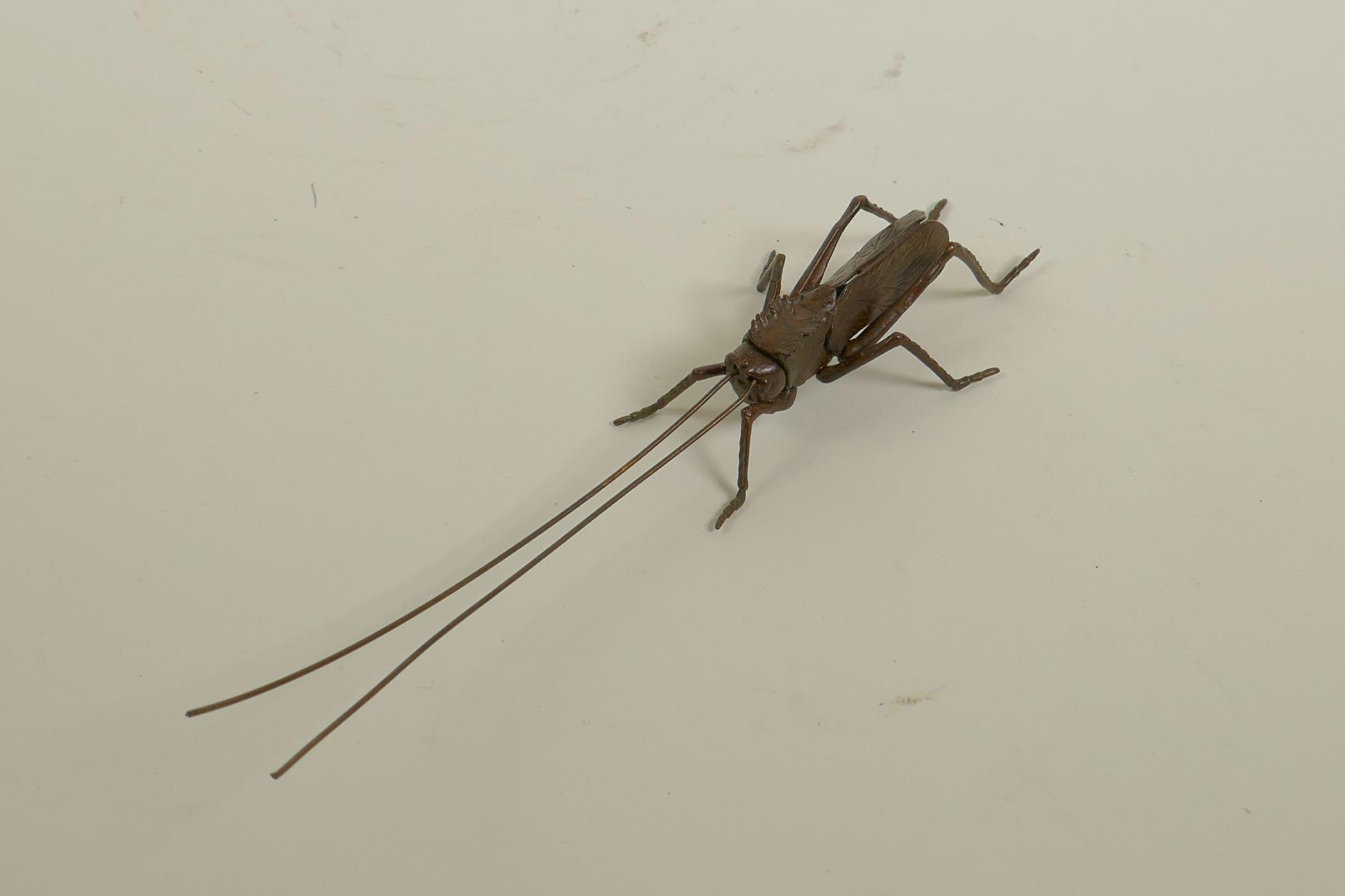 A Japanese Jizai style bronzed metal cricket, with articulated limbs and antennae, 6½" long - Image 2 of 2