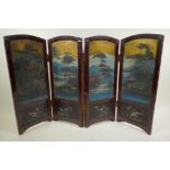 A Chinese four fold table screen painted with embossed lake landscape scenes with buildings and