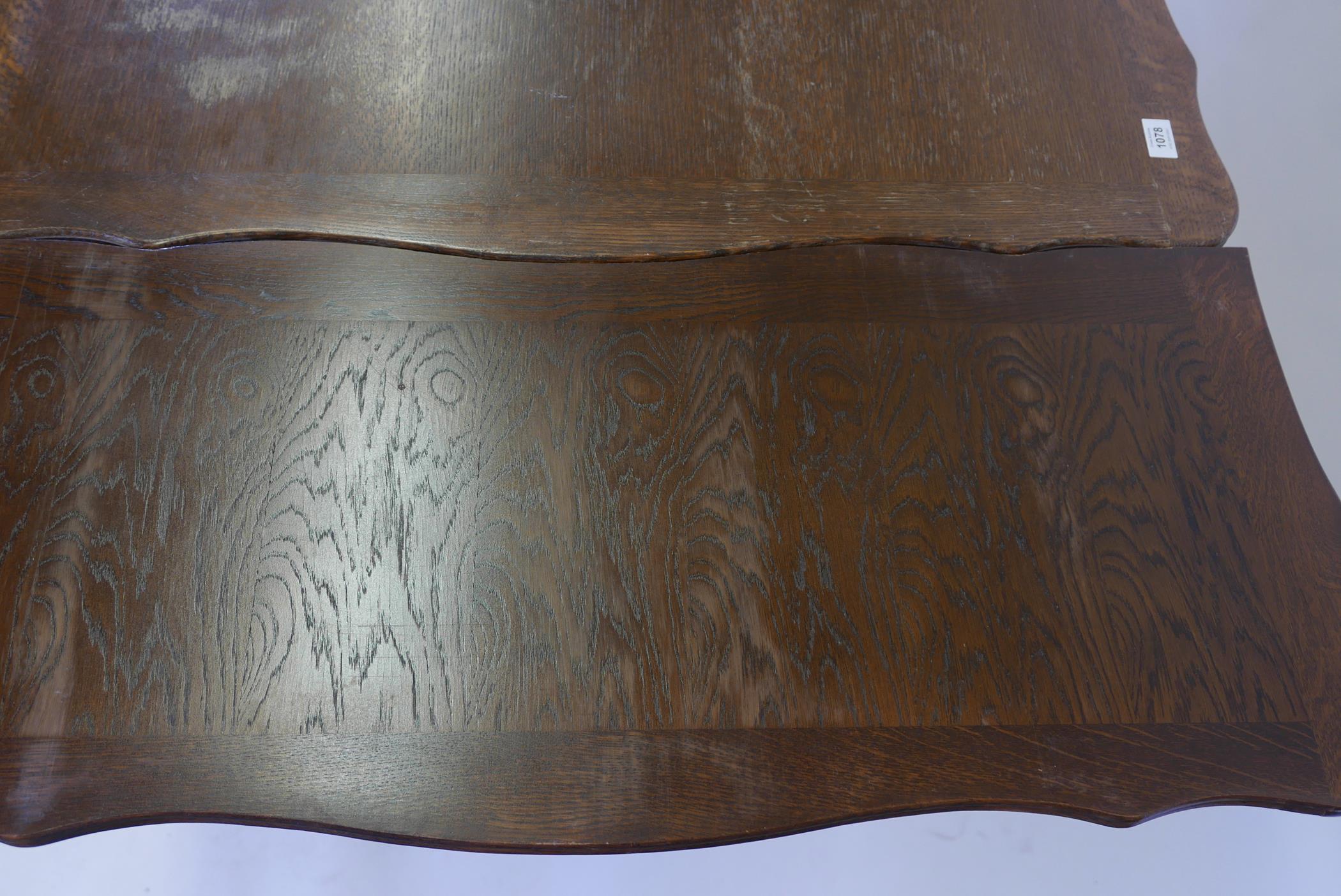 A French oak drawleaf dining table, with parquetry veneered top and pull out leaves, raised on - Image 4 of 4