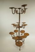 A sixteen-light wrought iron pricket candlestick, 26" high