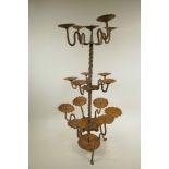 A sixteen-light wrought iron pricket candlestick, 26" high