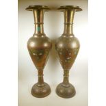 A pair of large Indian brass floor vases with engraved and painted decoration depicting peacocks,