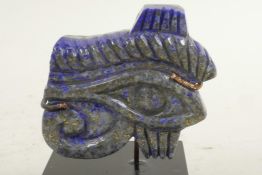 An Egyptian carved lapis eye, 2" wide