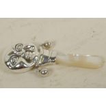 A silver and mother of pearl 'Moonface' rattle, 3" long