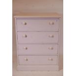 A Victorian painted pine chest of four long drawers, raised on a plinth base, 30" x 20" x 40"