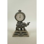 A silver plate mantel clock in the form of an elephant, 8" high