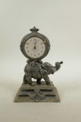 A silver plate mantel clock in the form of an elephant, 8" high