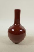 A Chinese sang de boeuf glazed porcelain bottle vase, seal mark to base, 6" high