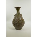 A Chinese olive and brown glazed pottery pear shaped vase with raised carp and lotus flower