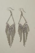 A pair of silver and cubic zirconium drop earrings, 4" drop