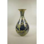 A Chinese blue and white pottery pear shaped vase decorated with figures in a landscape, 18" high,