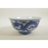 A Chinese blue and white porcelain bowl decorated with two dragons and the flaming pearl, 6