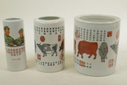 A set of three Chinese porcelain graduated brush pots decorated with calligraphy, cattle and