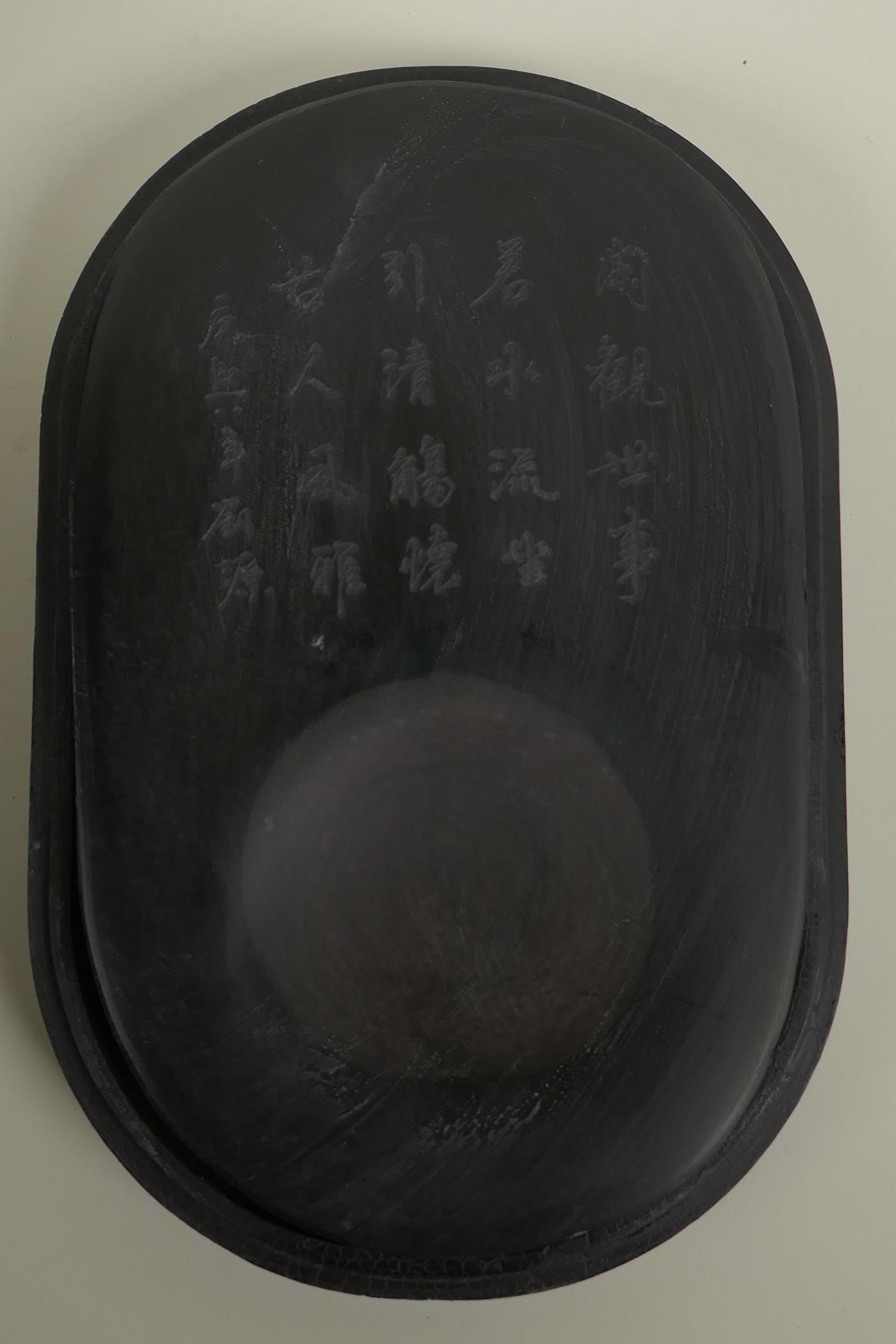 A Chinese boxed inkstone with an engraved inscription, the cover with inset figural decoration, - Image 2 of 4