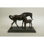 A 'crosa' bronzed composition figure group of a horse and foal, 10½" long
