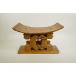 An African carved hardwood tribal stool, 14" wide