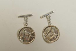 A pair of white metal Masonic cufflinks