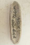 A Chinese silver ingot, incised with various scripts, 3½" x 1"